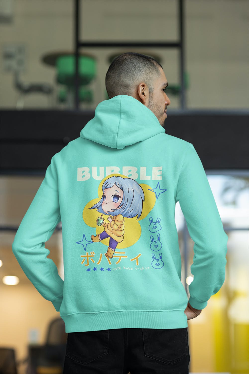办公室男性背影连帽衫设计样机图 Back View of a Man Wearing a Hoodie at The Office 样机素材 sucaiwan.com